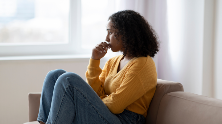 Woman looking out window